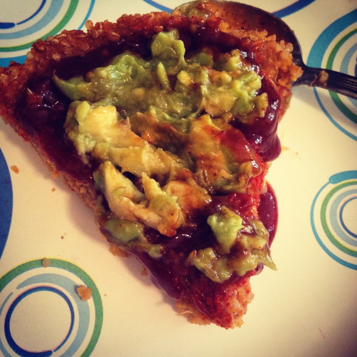 Quinoa-Polenta Pie topeed with guacamole and BBQ sauce.